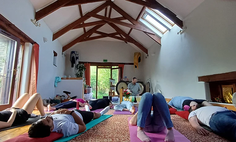 A sound bath set up at Eden Rise, with mats, cushions and instruments